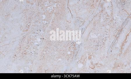 This image features a smooth, light-colored marble surface with subtle veining, suitable for interior design and architectural applications. Stock Photo