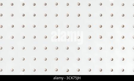 A textured background featuring a grid of evenly spaced holes, suitable for various design and display purposes. Stock Photo