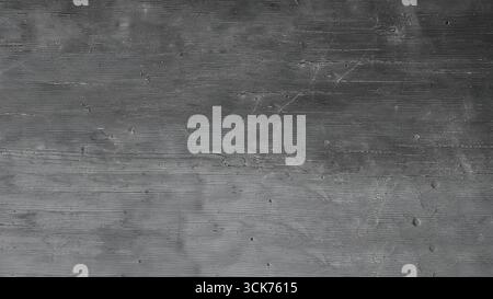 A textured image featuring a dark wooden surface with a weathered appearance, suitable for backgrounds or design elements. Stock Photo