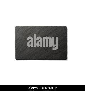 A rectangular black slate board with a textured surface, ideal for serving food or as a decorative piece. Stock Photo