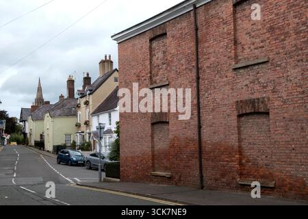 Window tax bricked up UK. This was a 18th and 19th centuries property tax based on the number of windows in a house. To avoid the tax, some houses from the period can be seen to have bricked-up window-spaces. Older red brick two story large Georgian – Victorian house. Ruthin, Denbighshire, Wales 2023 2020s  HOMER SYKES Stock Photo