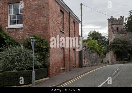 Window tax England. Bricked up windows UK. This was a 18th and 19th centuries property tax based on the number of windows in a house. To avoid the tax, some houses from the period can be seen to have bricked-up window-spaces. Older red brick two story large Georgian – Victorian house. Ruthin, Denbighshire, Wales 2023 2020s HOMER SYKES Stock Photo