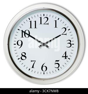A round wall clock displaying the time with clear numbers and hands. Stock Photo