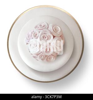 A beautifully decorated cake topped with pink and white rose-shaped icing, perfect for celebrations. Stock Photo