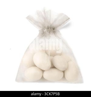 A sheer bag filled with white decorative eggs, often used for crafts or seasonal decor. Stock Photo