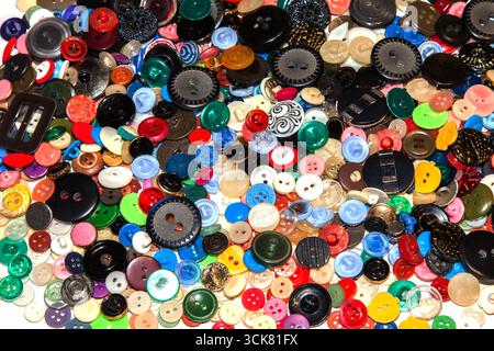 Multi-colored buttons on a white background close-up. Stock Photo