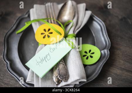 Festive easter table setting with colored eggs and easter bunny concept with copyspace Stock Photo