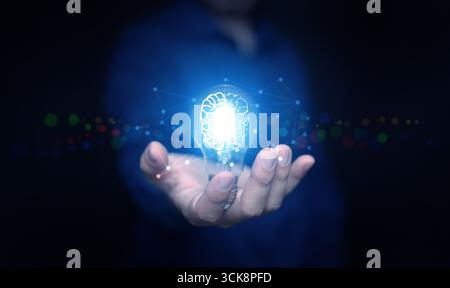 Bright light bulb with brain illustration and connected dots representing digital intelligence, creativity, AI innovation, smart thinking, and modern Stock Photo