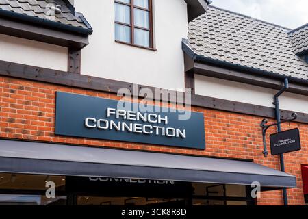 Cannock, Staffordshire, UK – September 9th 2025: Front logotype signage of French Connection, a global clothing brand at an outlet store Stock Photo