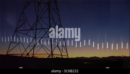 Looming transmission tower spanning ridge at dusk, with power lines, white bar overlay, copy space Stock Photo