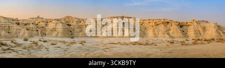 Panoramic Desert Landscape With Eroded Rock Formations in Bardenas Reales Natural Park. Sedimentary ridges, arid terrain, iconic Spanish badlands Stock Photo