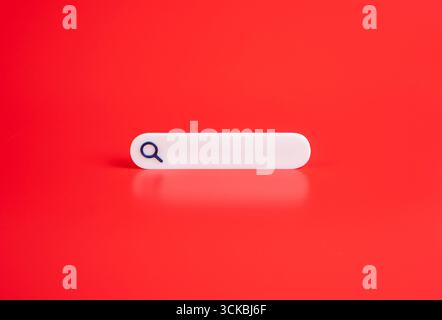 Search bar on red background. Internet navigation, and fast information. Technology, AI. Research concepts. Stock Photo