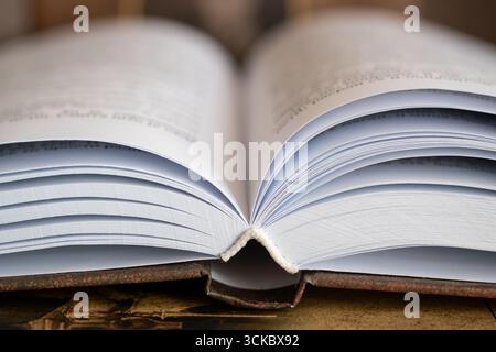 Open book close up with hardcover, book lying on book spine Stock Photo