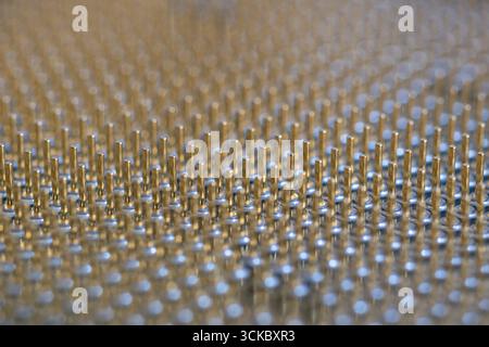 Pins on microprocessor close up, hardware component Stock Photo