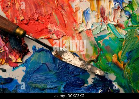 Close up of artists palette, oil paints and palette knife Stock Photo
