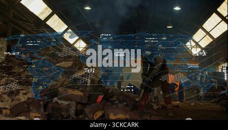 Construction workers wearing vests examining holographic map in warehouse, with stone blocks. Technicians, visualization, futuristic, industrial, coll Stock Photo