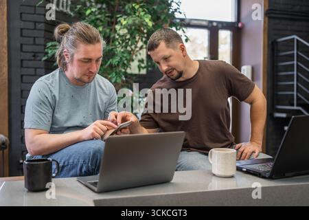 Engaging in a Collaborative Workspace Interaction between Two Dedicated Professionals Stock Photo