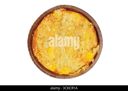 Apple pie baked in a paper mold isolated on a white background. Traditional cake. Top view. Stock Photo