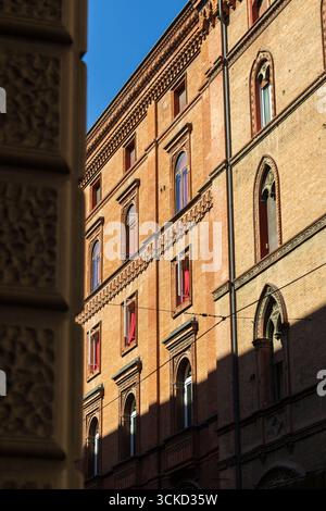 Red Brick Facade with Decorative Details in Bologna Stock Photo