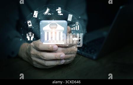Digital banking concept with smartphone, finance icons, global network, investment, credit card, and money management, representing fintech innovation Stock Photo