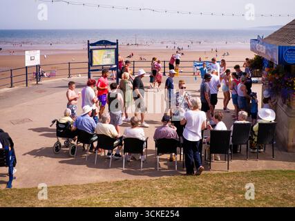 The ice cream queue at Filey seaside resort in Yorkshire]j]jj Stock Photo