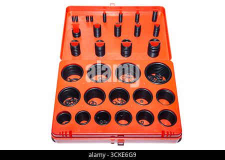 New rubber O-rings in different sizes stacked in an organizer box isolated on white background, close up Stock Photo