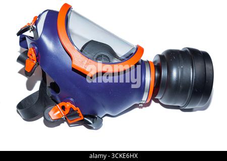 Protective face respirator mask with protective glass and replaceable filter, on a white background. Gas mask on a white background. Stock Photo
