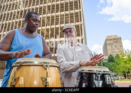 Huntsville Alabama,Big Spring Park,Black African man men friends play playing conga drums, Stock Photo