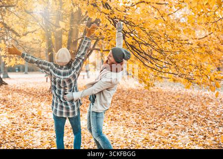 cheerful couple taking an autumn walk Stock Photo