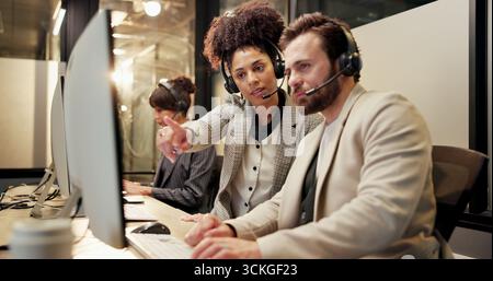 Headset, computer and call center agent with manager in office for feedback on crm or contact us. Communication, advice and technical support Stock Photo