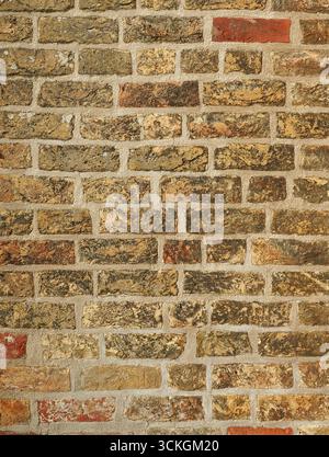 Historic Brick Facade with Patina and Color Texture Stock Photo