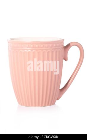 A single, elegant pink ceramic mug with a ribbed texture and a dotted rim, isolated on a white background, perfect for a cozy drink. Stock Photo