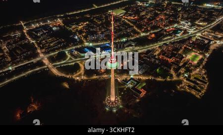 Aerial view of the illuminated cityscape of Vilnius at night with ...