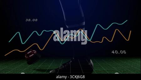 Showing athlete leg in striped sock, cleat on green grid floor, with sensor, graphs and metrics Stock Photo