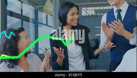Businesswoman in blazer presenting in office meeting room, with laptop and neon-green blue graphs Stock Photo