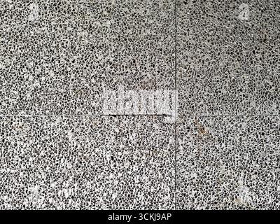 Close up of rough concrete wall with exposed aggregate stone texture . High quality photo Stock Photo
