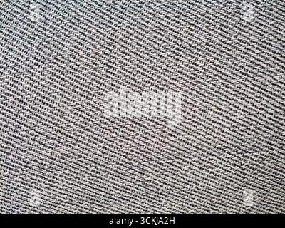 Close up of blue grey denim jeans fabric with diagonal woven texture . High quality photo Stock Photo