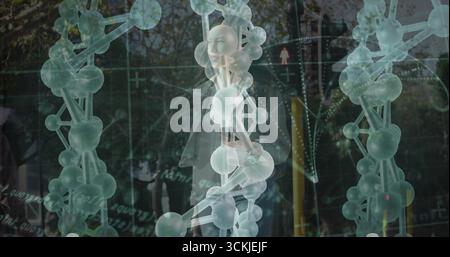 Displaying molecular chain over wooded AR scene, with floating data overlays, connection points Stock Photo