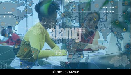 Four students collaborating around study table, with laptops notebooks textbooks digital overlay Stock Photo