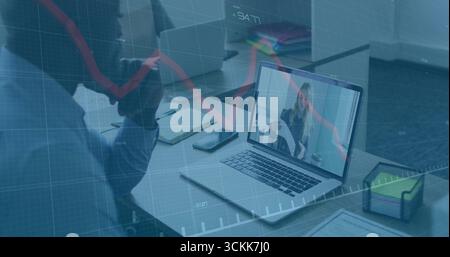 Displaying laptop showing woman speaking on conference call at office desk, with chart overlay Stock Photo