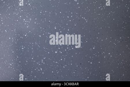 Gray ceramic coating with black and white dots on a pan or pot, abstract close up texture Stock Photo