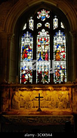 Arched stained-glass windows and a glass-paneled doorway line a ...