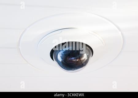 CCTV camera on the hull of an expensive motor yacht. CCTV camera white on a white body. Stock Photo