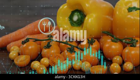 Displaying yellow bell peppers, cherry tomatoes, carrots on table, with utensil icon, data overlays Stock Photo