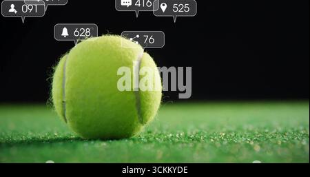Resting single yellow-green tennis ball on artificial court turf, with social media UI bubbles Stock Photo