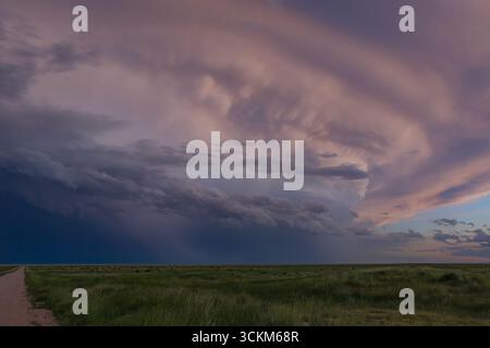 Anvil cloud forming with cloud to cloud lightning and rotation in southeast Colorado Stock Photo