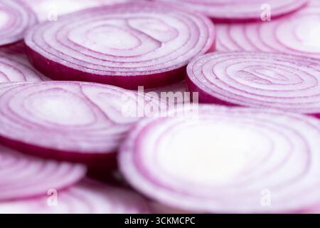 Sliced red onion rings on white background Stock Photo