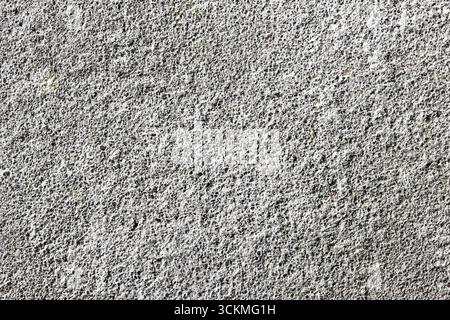 Concrete wall surface background. Gray cement texture with rough details. Industrial construction material pattern. Abstract backdrop of urban. Stock Photo