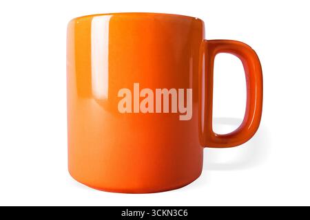 An orange coffe mug on white background, isolated. Stock Photo