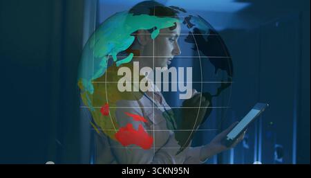 Interacting technician monitoring networks on tablet in server rack corridor, globe projection Stock Photo